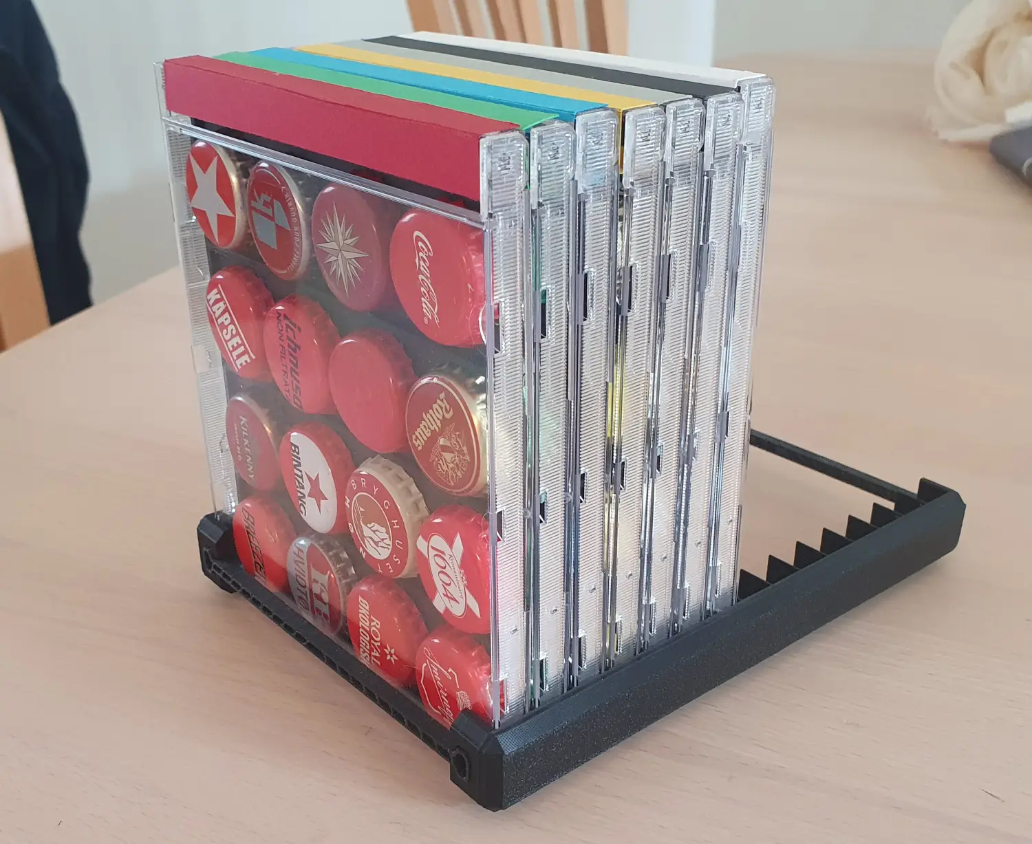My first CD-based prototype for displaying bottle caps. The holder for the case is made by PeterNelson and can be found here.