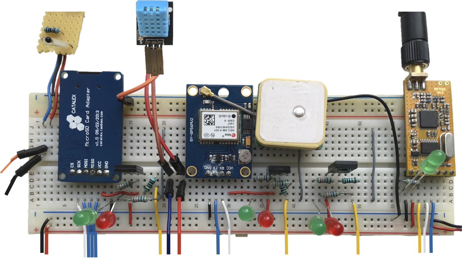 Breadboard of the air quality measurement station. From left-to-right: thermistor, micro SD adapter, air humidity sensor, GPS & antenna and wireless module.